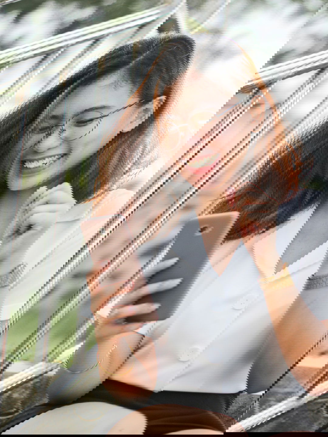 woman-in-white-button-up-shirt-holding-silver-iphone-6.jpg woman in white button up shirt holding silver iphone 6